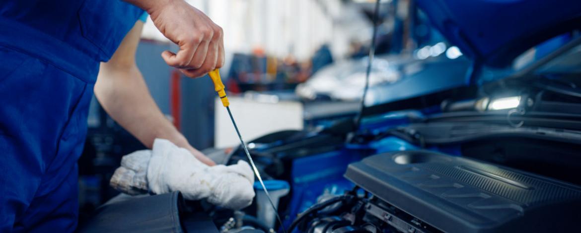 Use the yellow colored dipstick to check your engine oil level